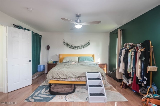 bedroom featuring hardwood / wood-style floors and ceiling fan