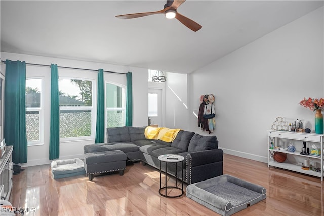 living room featuring ceiling fan and hardwood / wood-style flooring