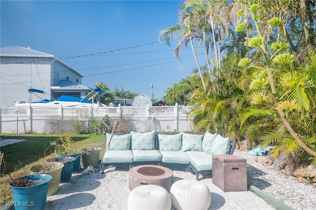 view of patio / terrace with an outdoor living space with a fire pit