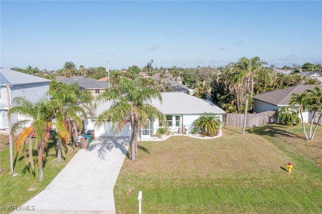 view of front of house with a garage and a front yard