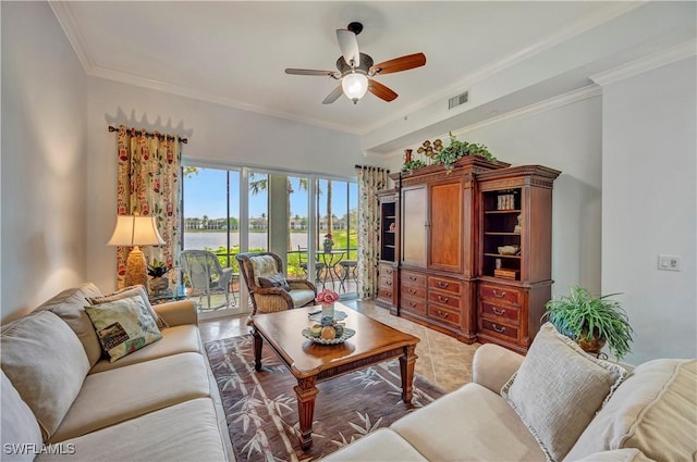 tiled living room with ceiling fan and ornamental molding