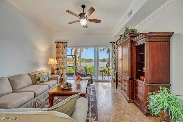 living room with ceiling fan, light tile patterned floors, and ornamental molding