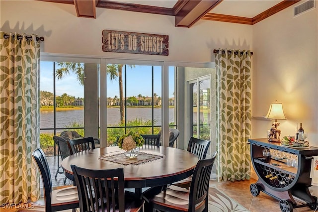 tiled dining space featuring beam ceiling, a water view, and coffered ceiling