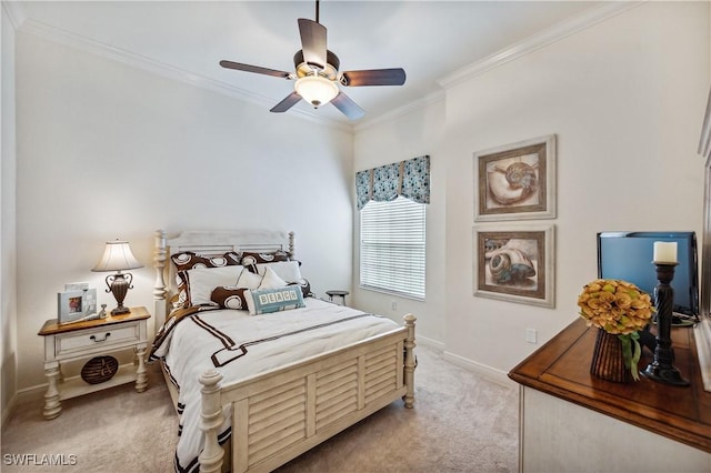 bedroom with light colored carpet, ceiling fan, and crown molding