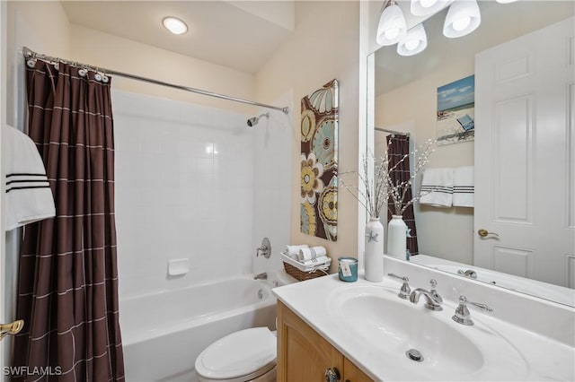 full bathroom featuring shower / bath combo, toilet, and vanity