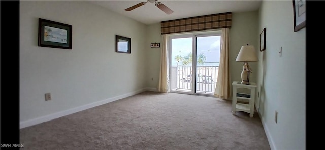 spare room with ceiling fan and light carpet