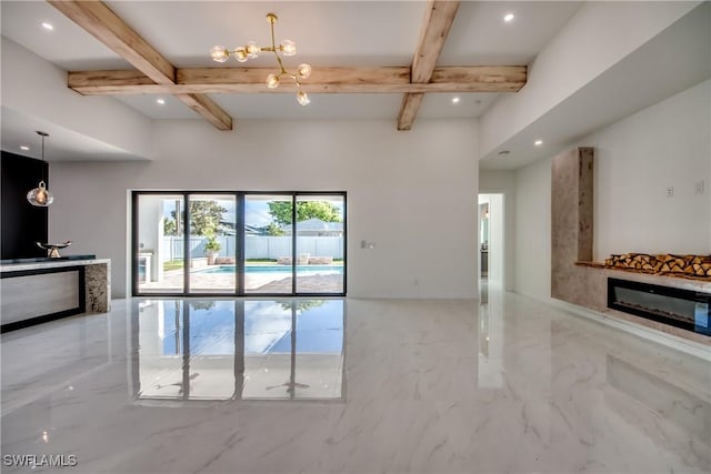 living room featuring coffered ceiling, beam ceiling, and a notable chandelier