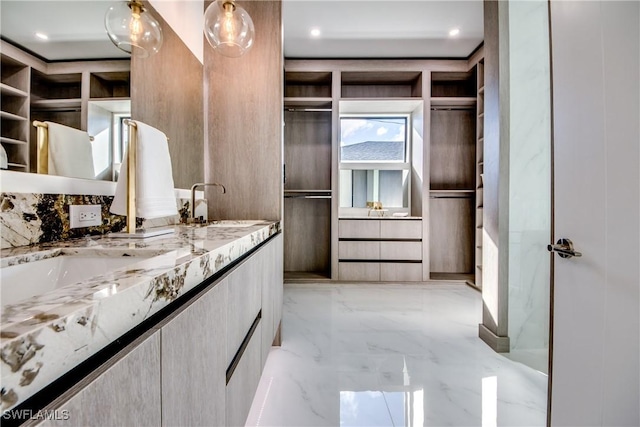 spacious closet featuring sink