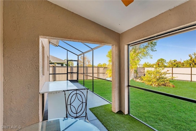 unfurnished sunroom featuring a healthy amount of sunlight and lofted ceiling