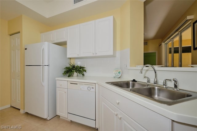 kitchen featuring white cabinets, white appliances, sink, and light tile patterned floors