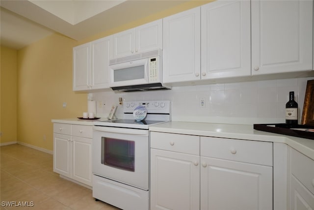 kitchen featuring tasteful backsplash, white cabinetry, and white appliances