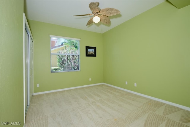 carpeted empty room with ceiling fan