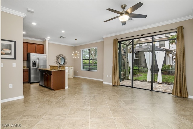 kitchen featuring baseboards, stainless steel fridge, and ornamental molding