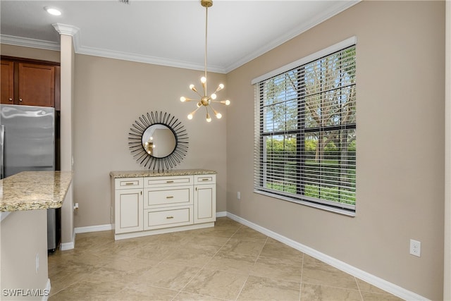 unfurnished dining area with a healthy amount of sunlight, baseboards, an inviting chandelier, and ornamental molding