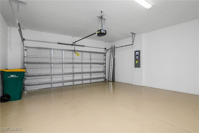 garage featuring electric panel and a garage door opener