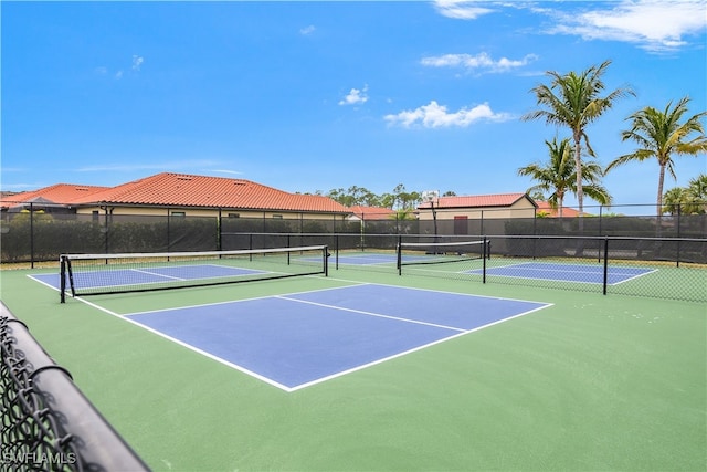 view of sport court with fence