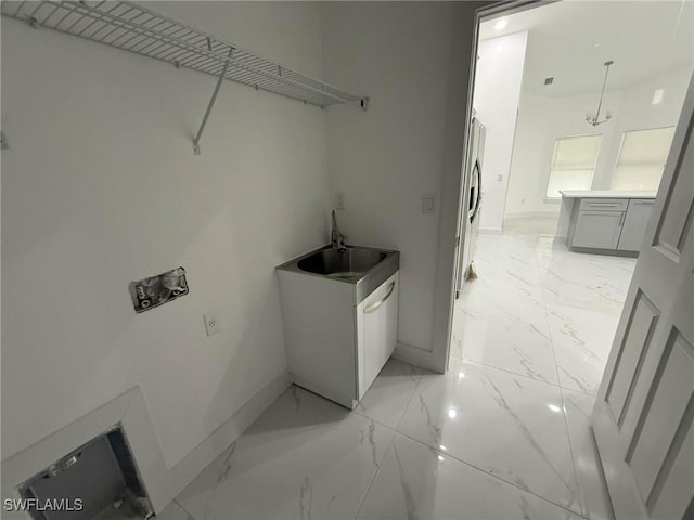 laundry area with sink