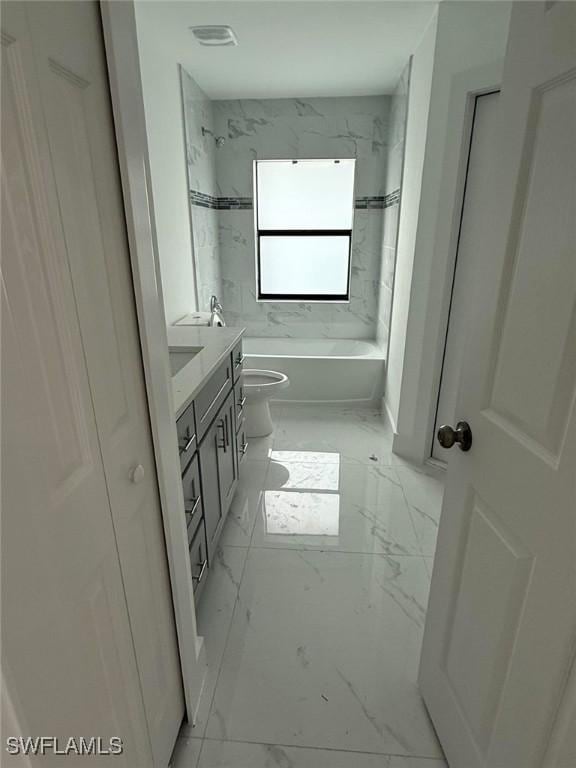 full bathroom featuring vanity, toilet, and tiled shower / bath combo