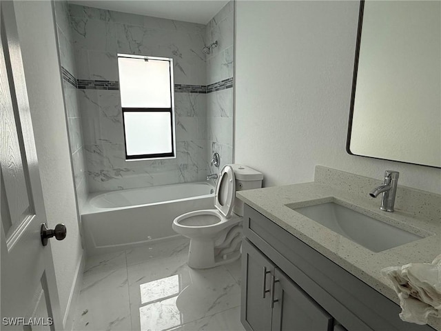 full bathroom with vanity, toilet, and tiled shower / bath