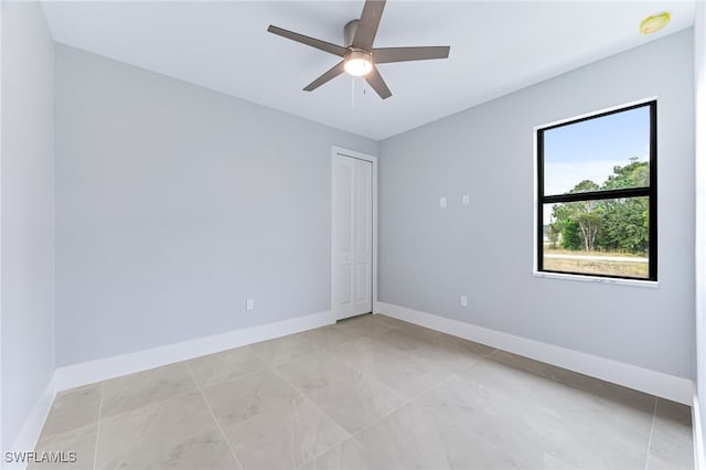 spare room featuring ceiling fan