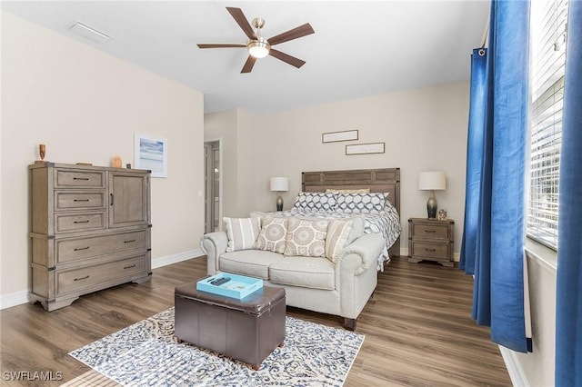 bedroom with ceiling fan and hardwood / wood-style floors