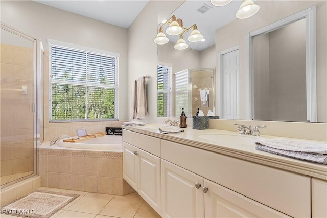 bathroom featuring vanity, tile patterned floors, an inviting chandelier, and independent shower and bath