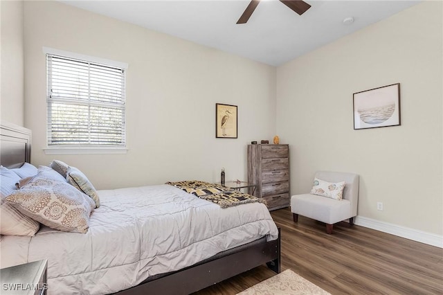 bedroom featuring ceiling fan and dark hardwood / wood-style floors