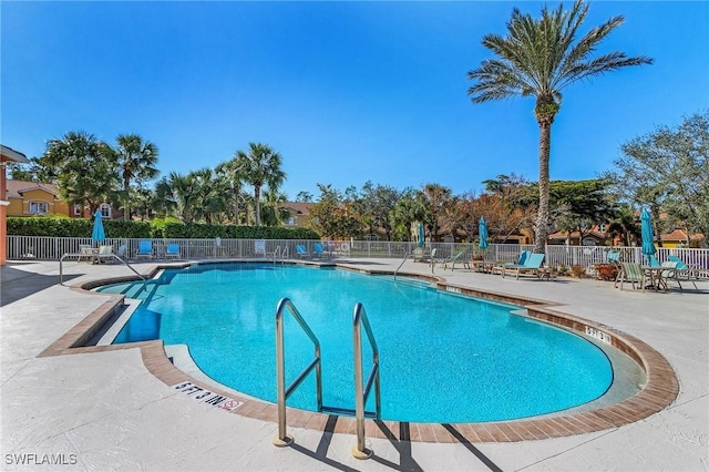 view of pool featuring a patio