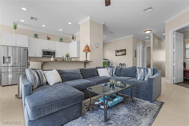 tiled living room with ornamental molding