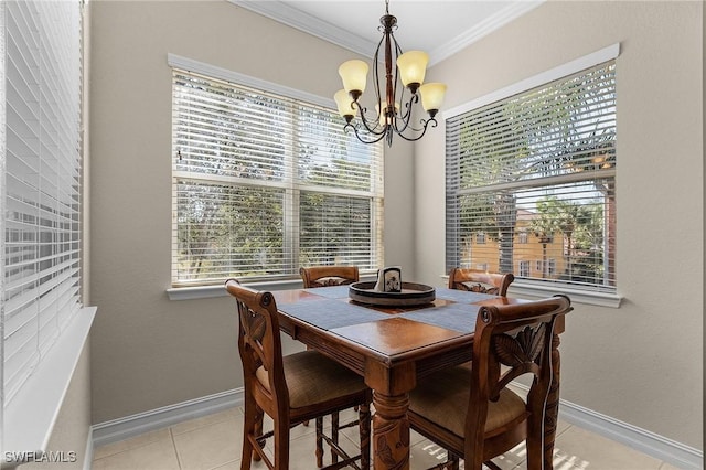 dining space featuring a chandelier, light tile patterned floors, and crown molding