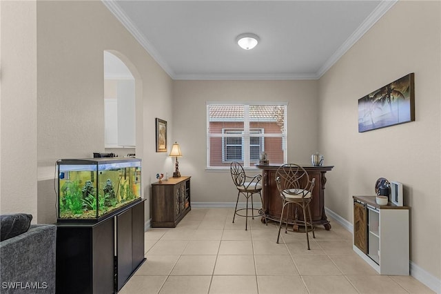 dining room with bar, light tile patterned flooring, and ornamental molding