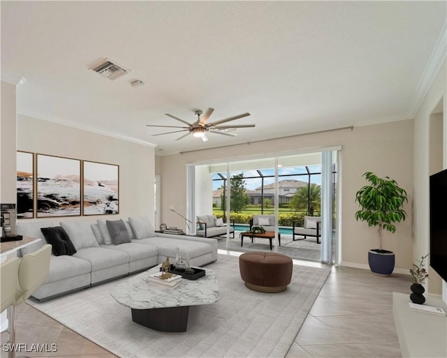 living room with ceiling fan, ornamental molding, and light tile patterned flooring