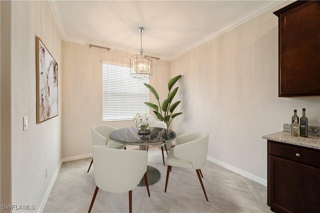 dining space featuring crown molding, light tile patterned floors, and a chandelier