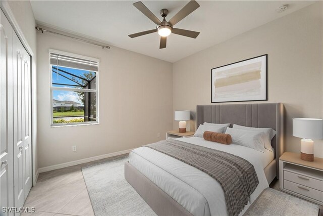 tiled bedroom featuring a closet and ceiling fan