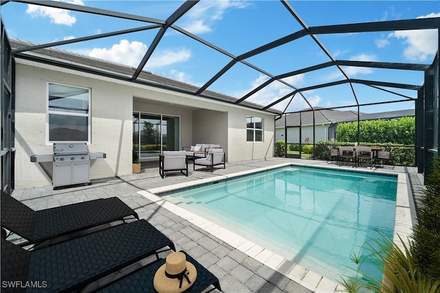 view of pool with an outdoor living space, a patio area, a lanai, and a grill