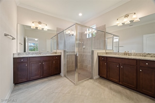 bathroom featuring ornamental molding, a shower with door, and plenty of natural light