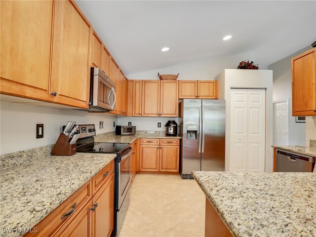 kitchen with stainless steel appliances, light tile patterned flooring, recessed lighting, lofted ceiling, and light stone countertops