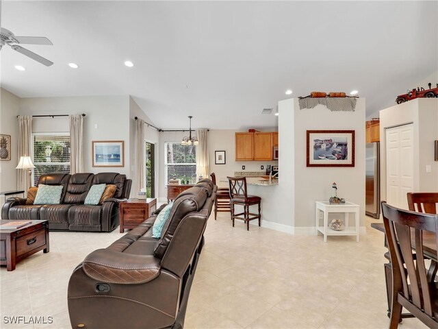living area with ceiling fan, light tile patterned floors, and recessed lighting