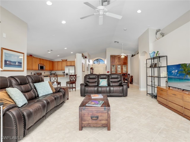 tiled living room featuring vaulted ceiling and ceiling fan