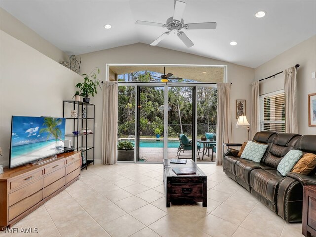 living room with recessed lighting, lofted ceiling, a ceiling fan, and light tile patterned floors