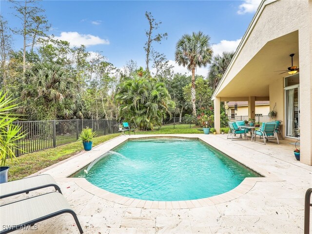 view of pool with a fenced backyard, a ceiling fan, a fenced in pool, and a patio