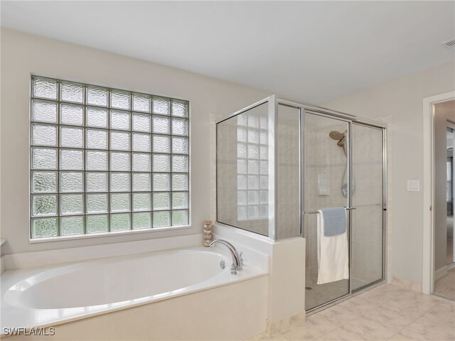 full bathroom with a garden tub, visible vents, and a stall shower