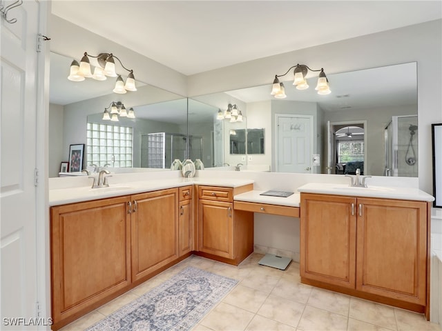 bathroom with vanity, a shower with shower door, and tile patterned floors