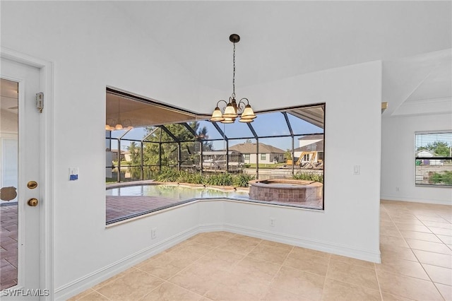 unfurnished dining area with light tile patterned floors, a notable chandelier, and a wealth of natural light