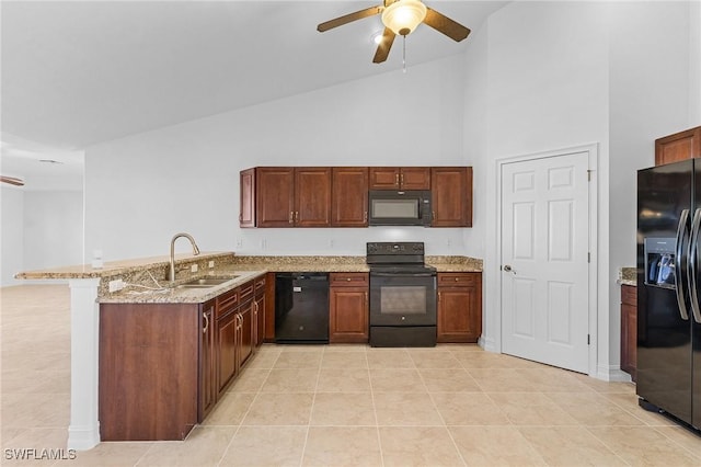 kitchen with kitchen peninsula, ceiling fan, black appliances, light stone counters, and sink