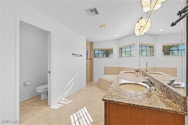 full bathroom featuring toilet, vanity, tile patterned flooring, and shower with separate bathtub