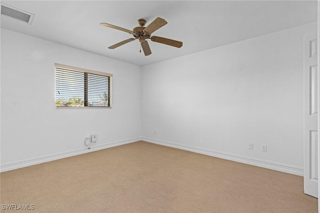 empty room with light carpet and ceiling fan