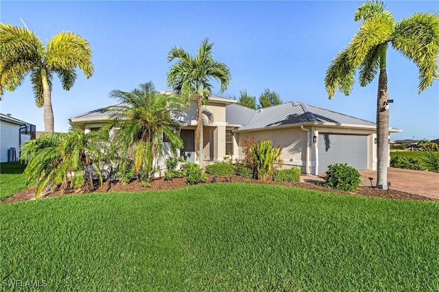 view of front facade featuring a front lawn and a garage