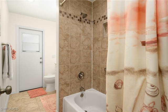 bathroom featuring shower / bath combination with curtain and toilet