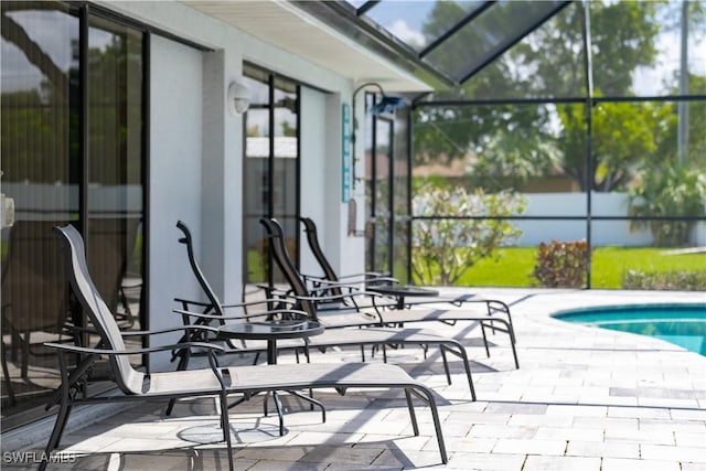 view of patio / terrace with a lanai